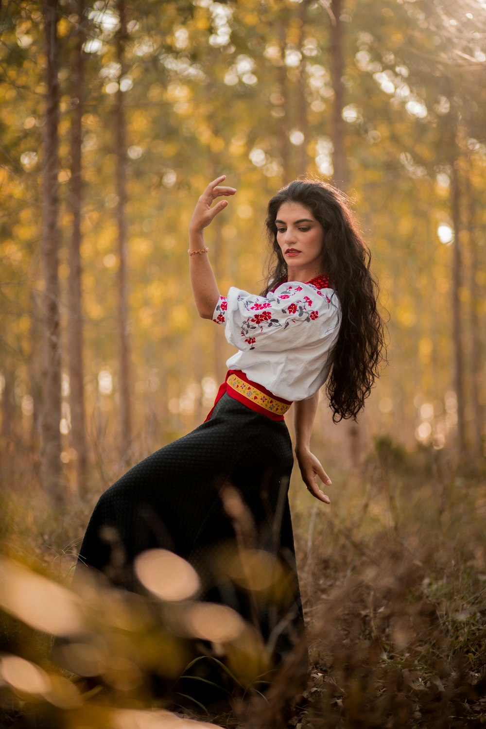 a person posing in the woods