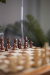 a chess board with a stick and a game pieces