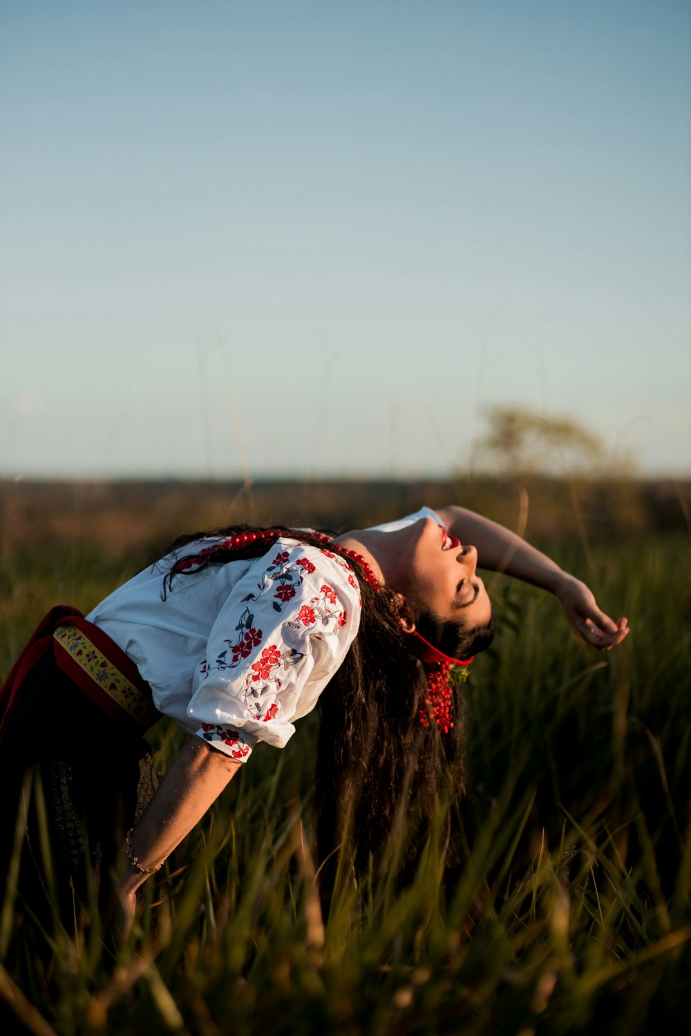 a man lying in a field of tall grass