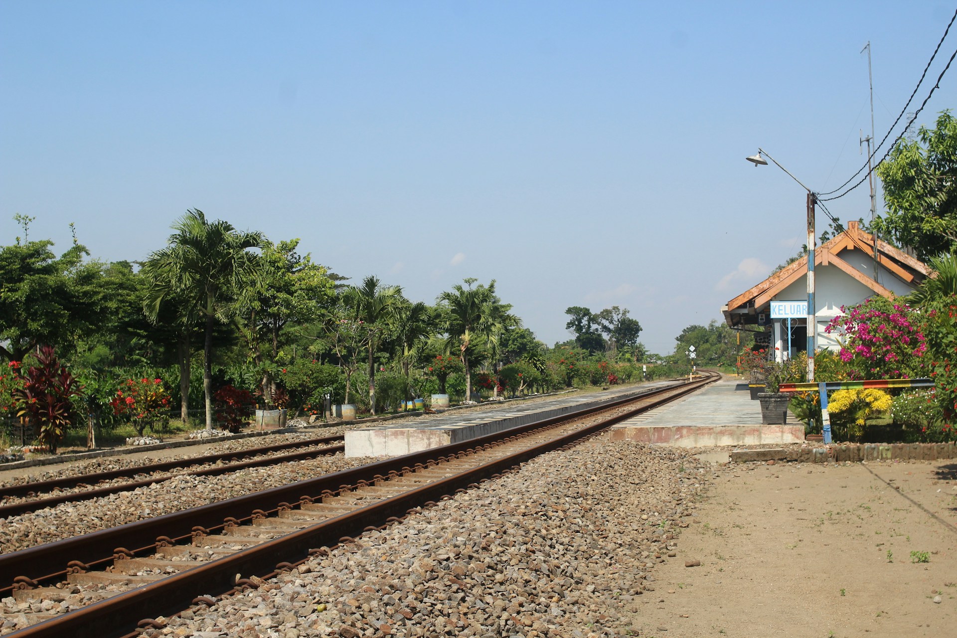 train tracks next to a building