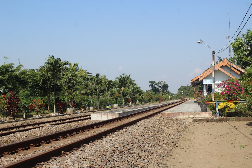 train tracks next to a building