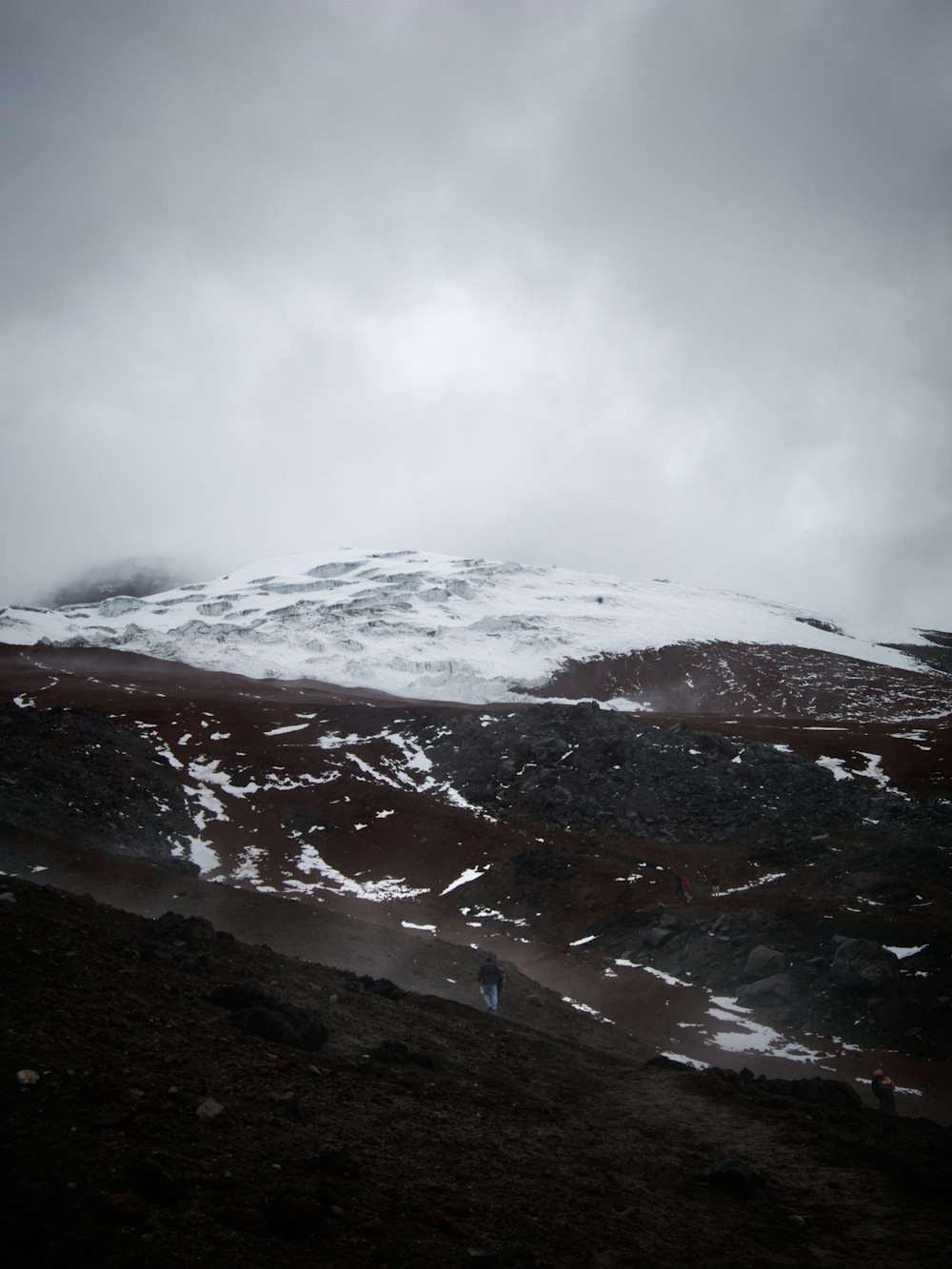 a person walking on a snowy mountain