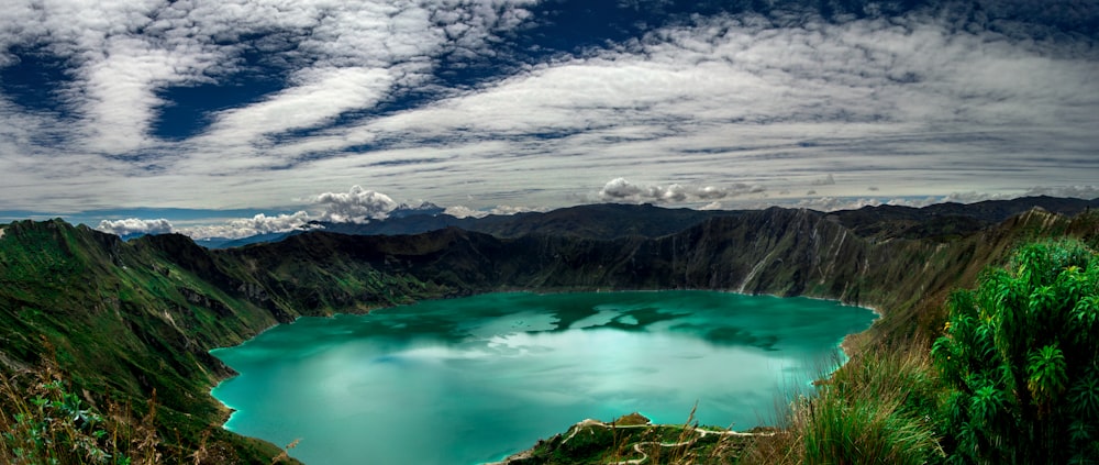 a body of water surrounded by mountains