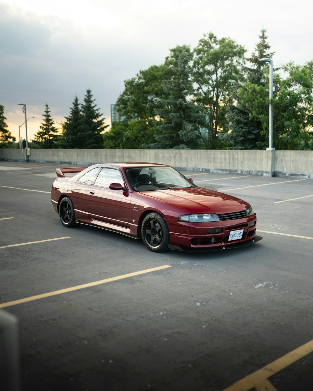 a red car parked in a parking lot