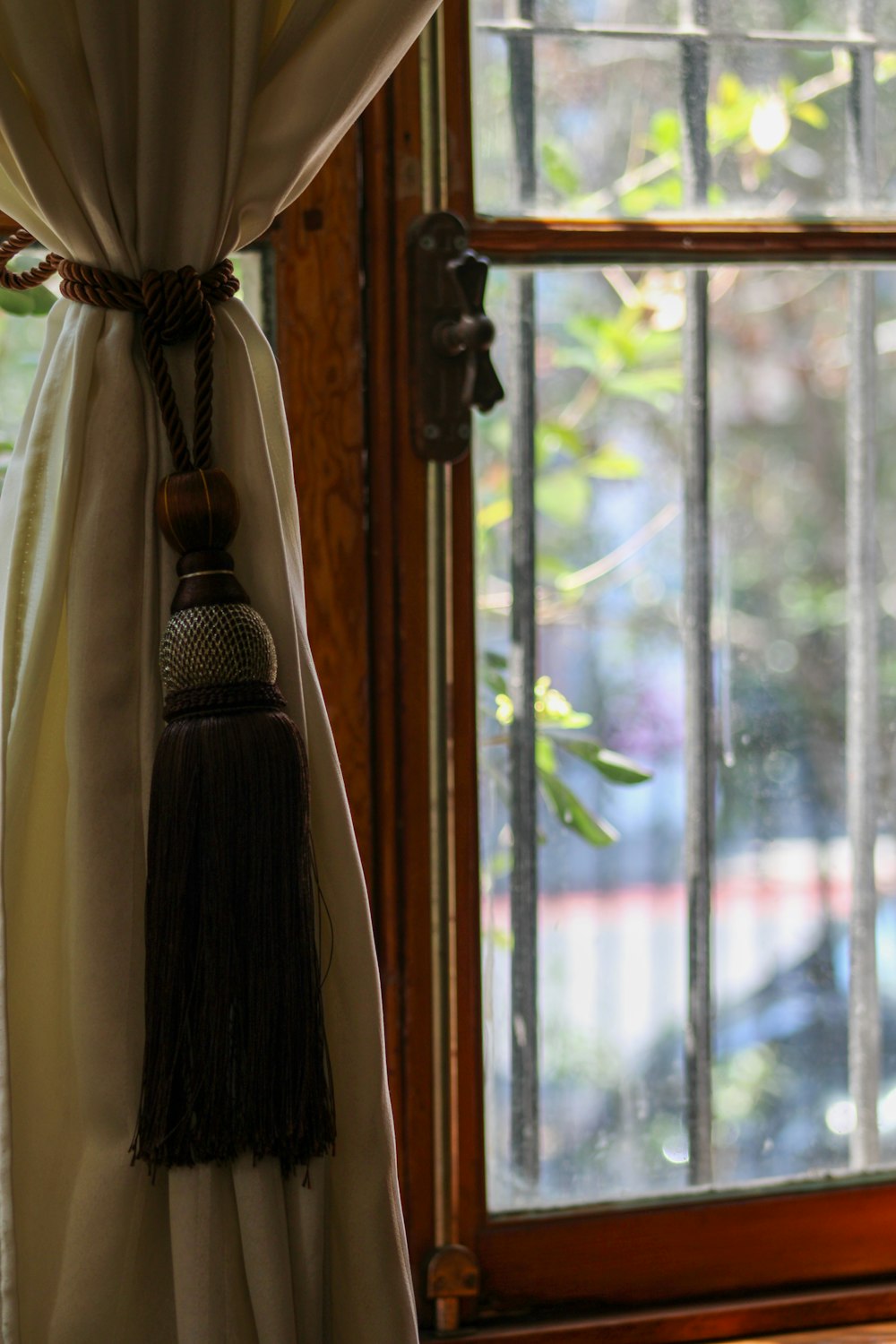 a black and brown robe on a window sill