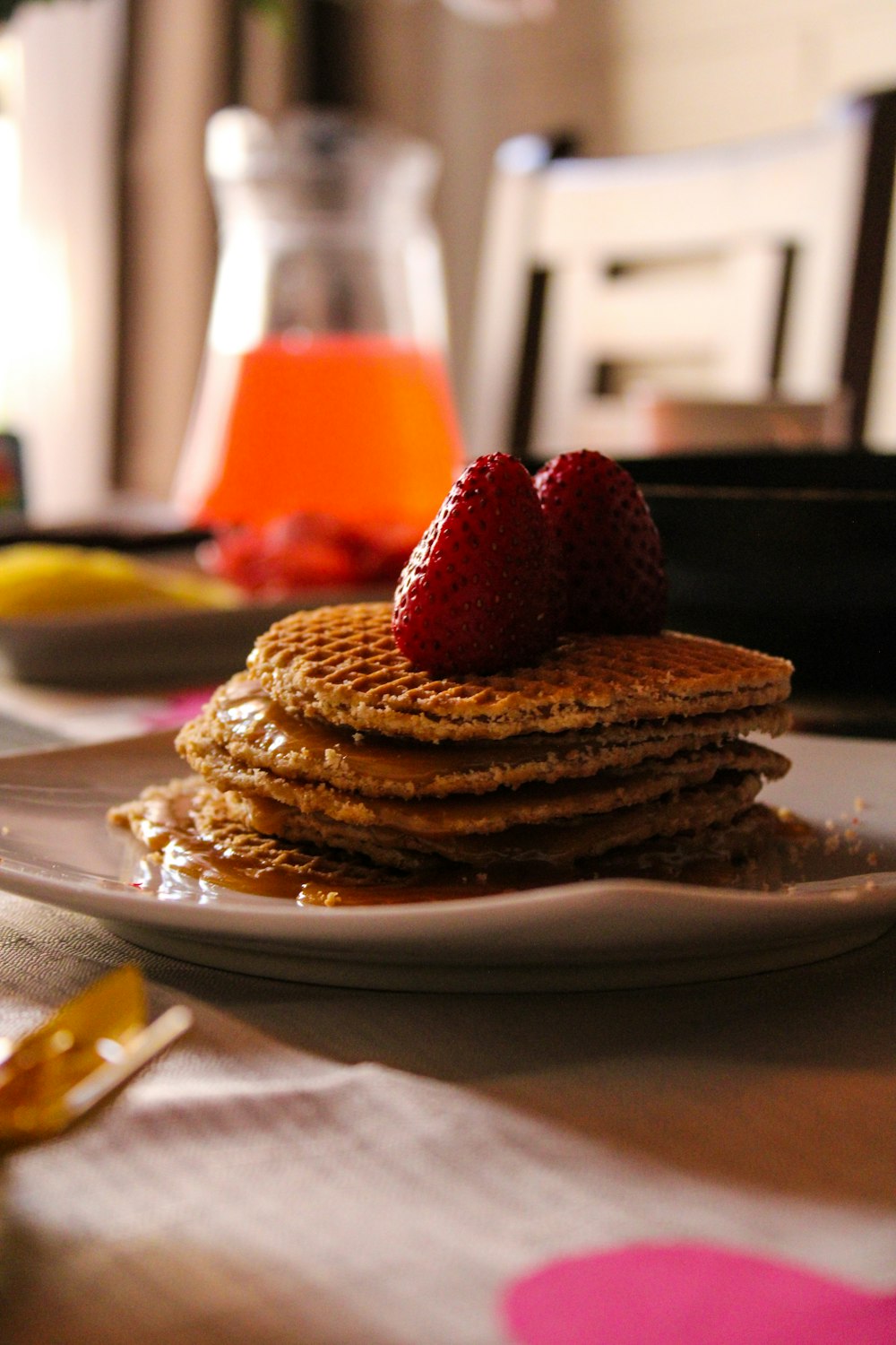 a stack of pancakes with strawberries on top