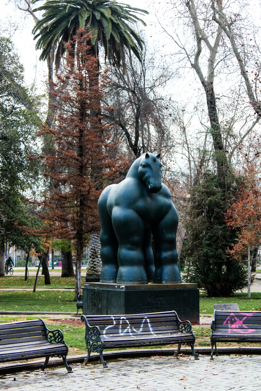 a statue of a bear in a park