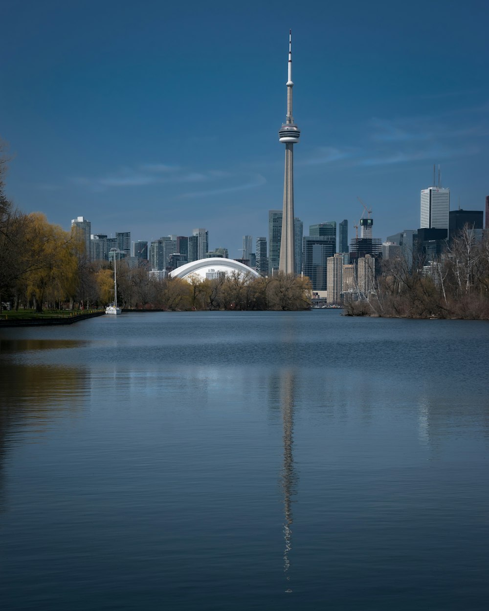 a body of water with a city in the background