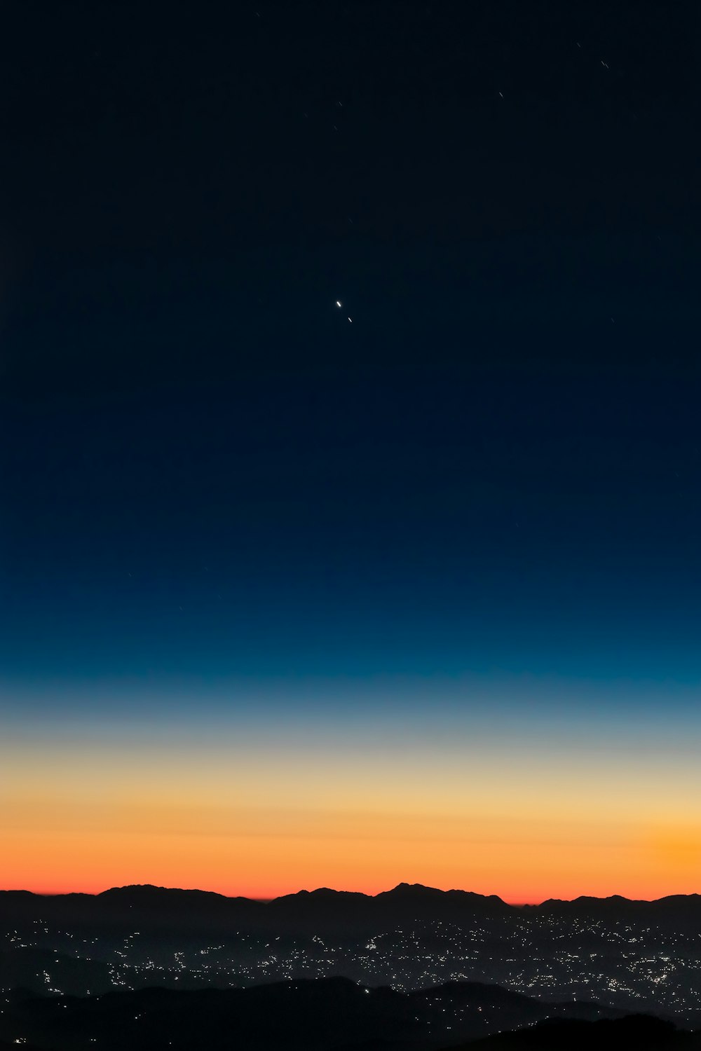 a view of the moon and the earth from a distance