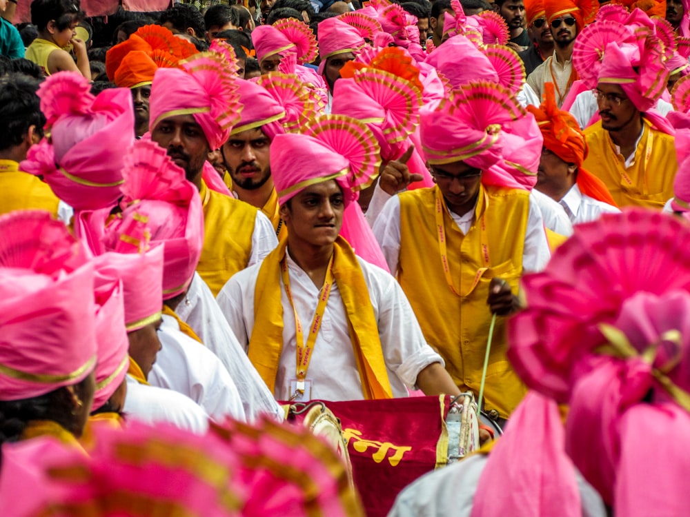 a group of people wearing colorful hats