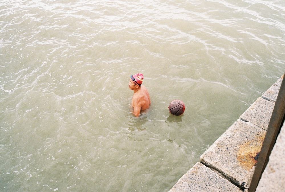 a couple of people playing in the water