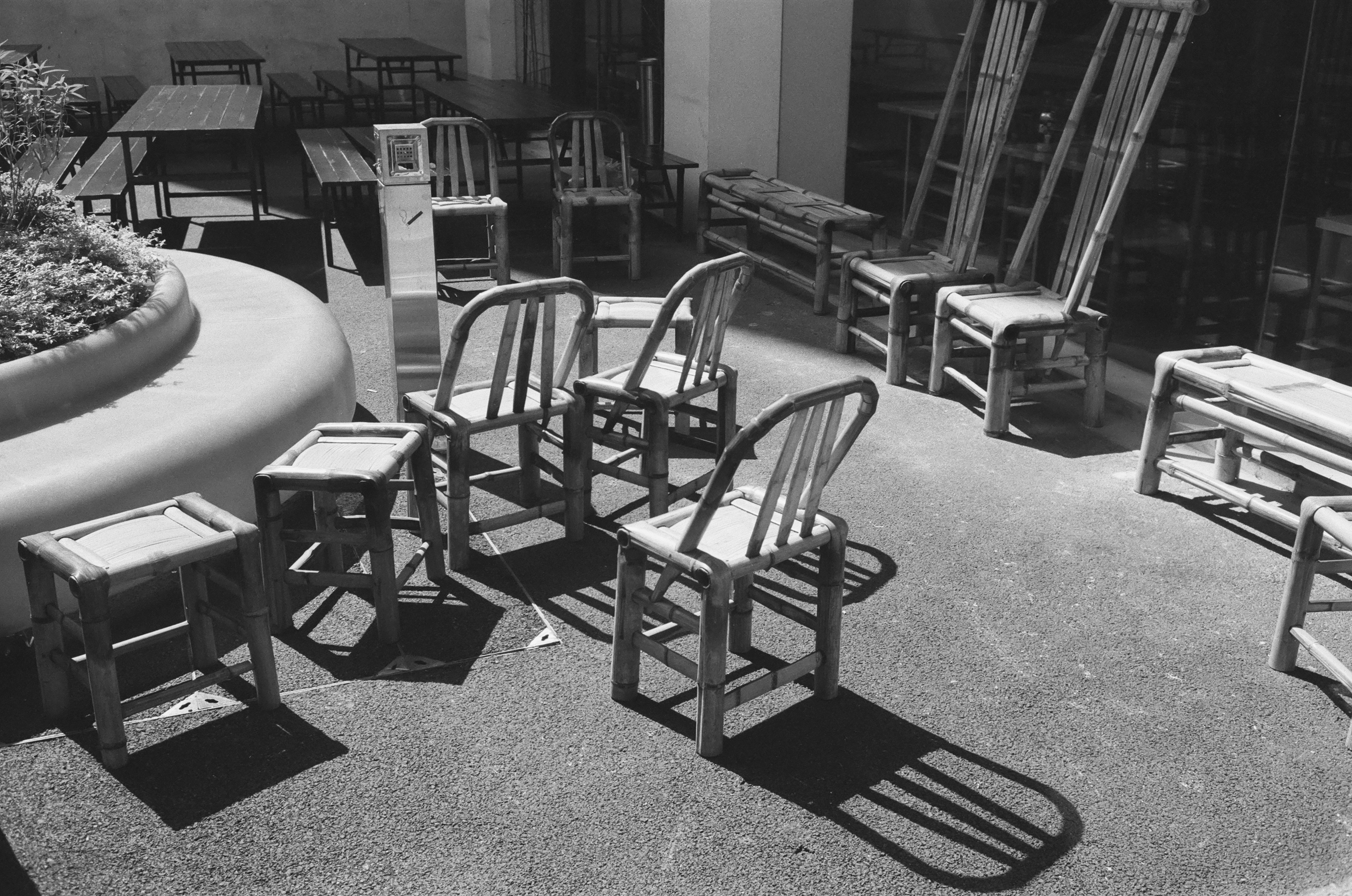 A handyman assembling furniture in a living room.