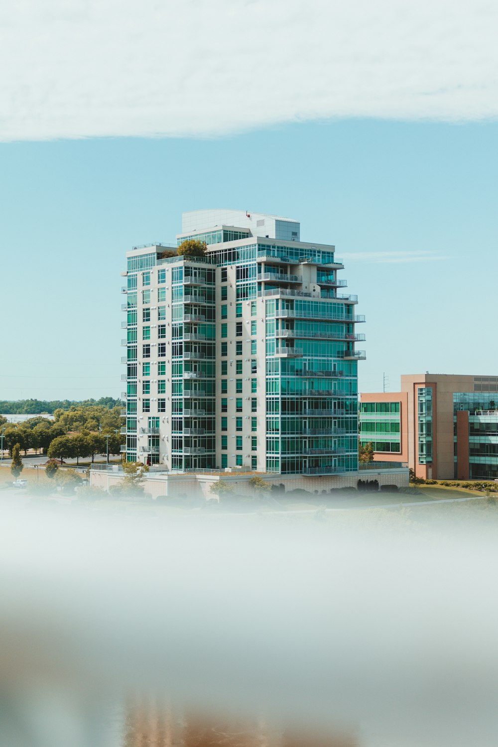 a building with a body of water in the front