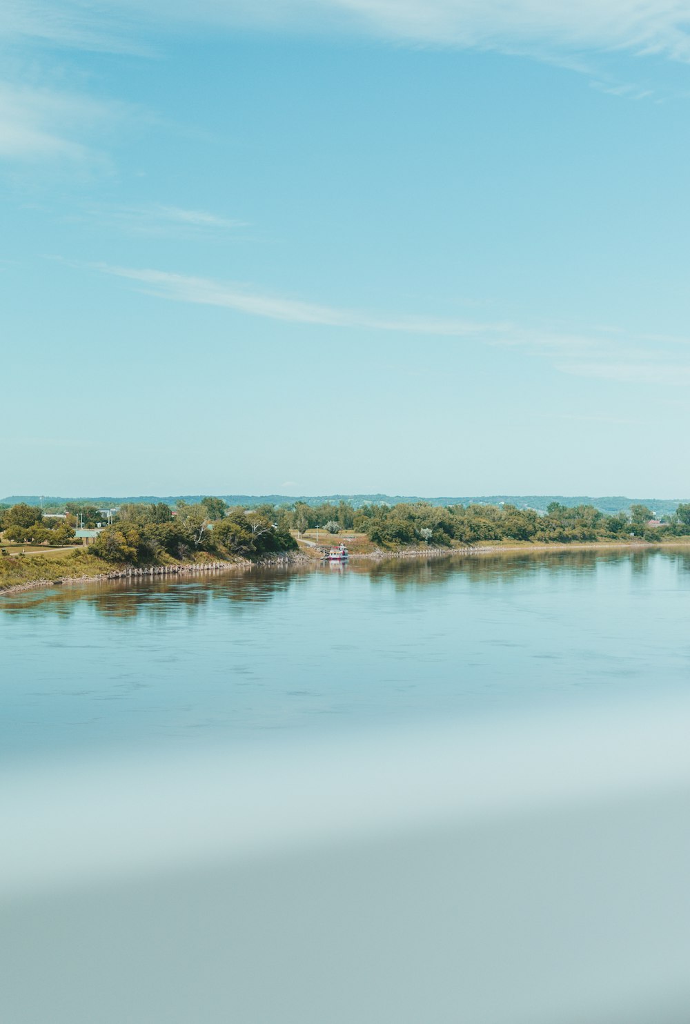 a body of water with land in the back