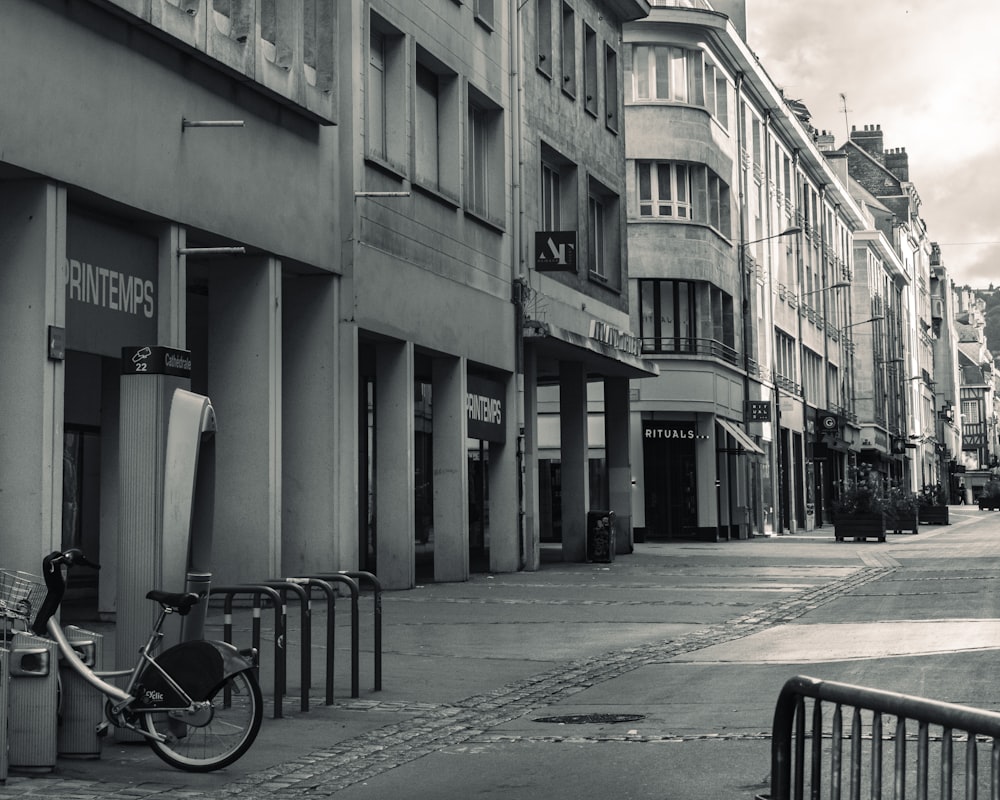 a bicycle parked on the side of a street