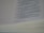 A close-up view of an open book with text focused on religious or biblical content. The visible lines of text are clear and legible, set on an off-white page with a noticeable thickness on the page edges.