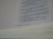 A close-up view of an open book with text focused on religious or biblical content. The visible lines of text are clear and legible, set on an off-white page with a noticeable thickness on the page edges.