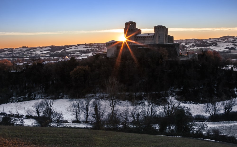 a building on a hill with snow