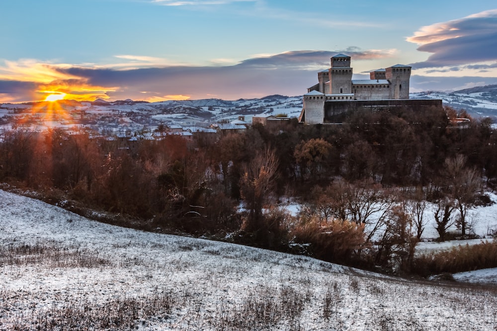 a building on a hill with snow