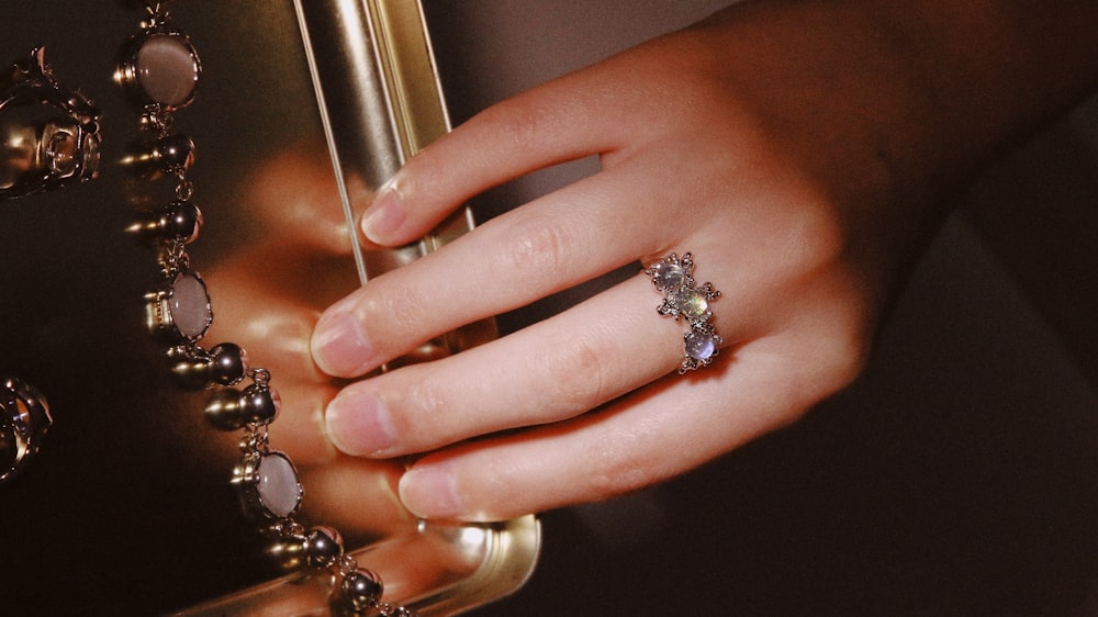 a hand holding a key chain