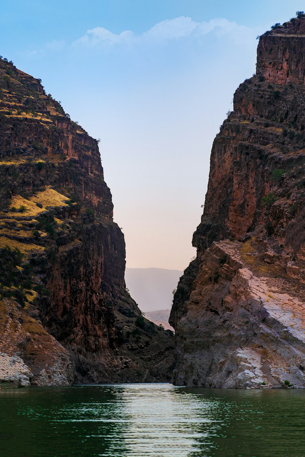 a body of water between large rocks