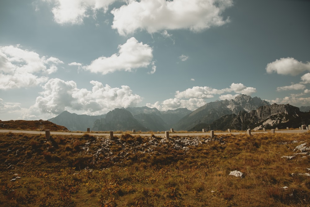 a landscape with mountains in the back