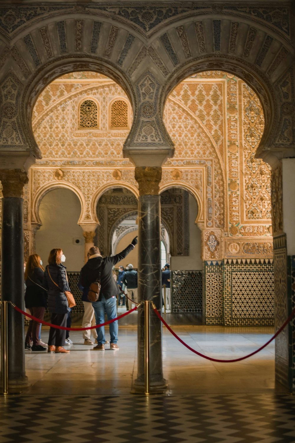 a group of people standing in a building