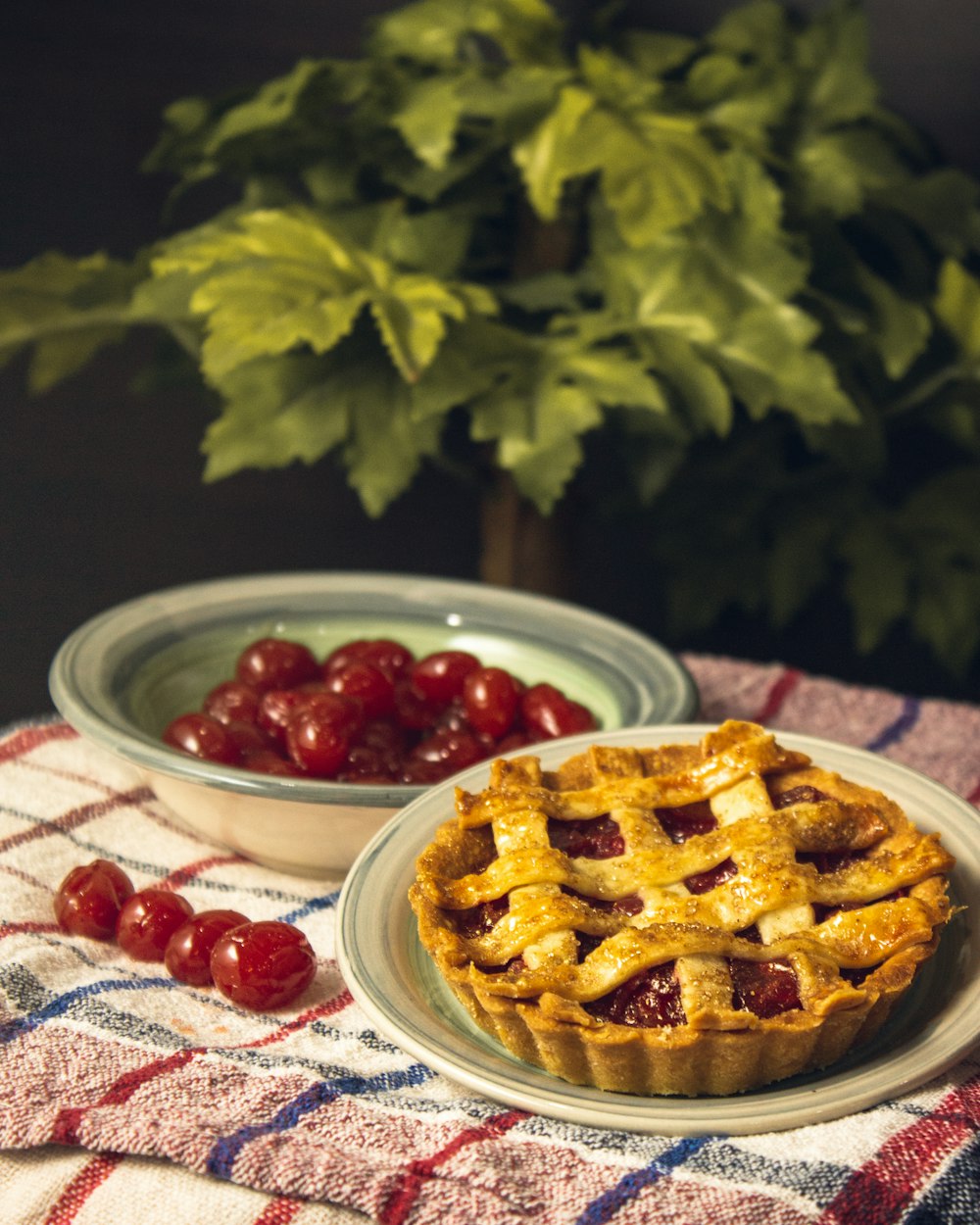 a plate of food next to a bowl of berries