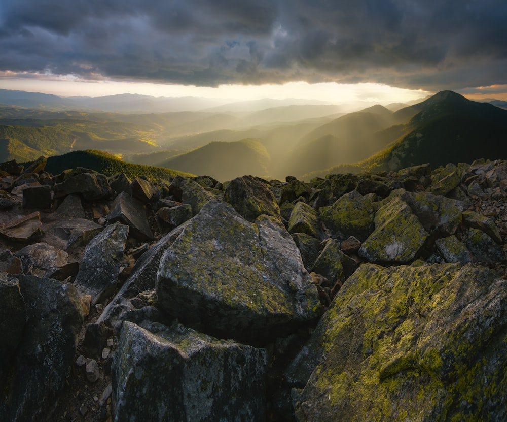 a rocky landscape with a cloudy sky