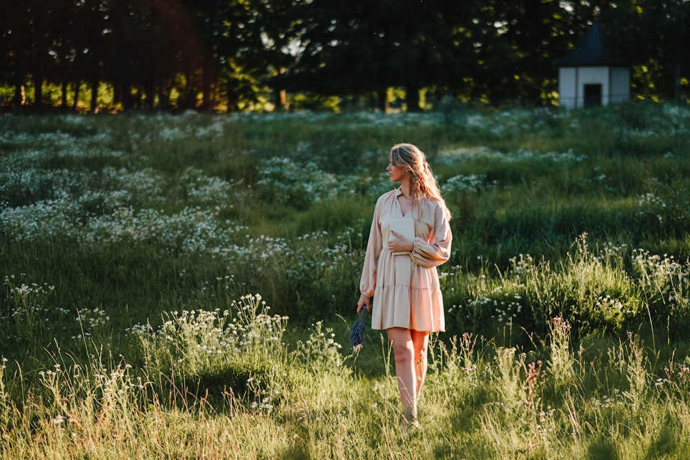 a person standing in a field of flowers