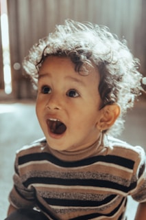 a child with curly hair