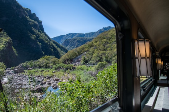 A scenic view from the window of Train A showcasing beautiful landscapes.