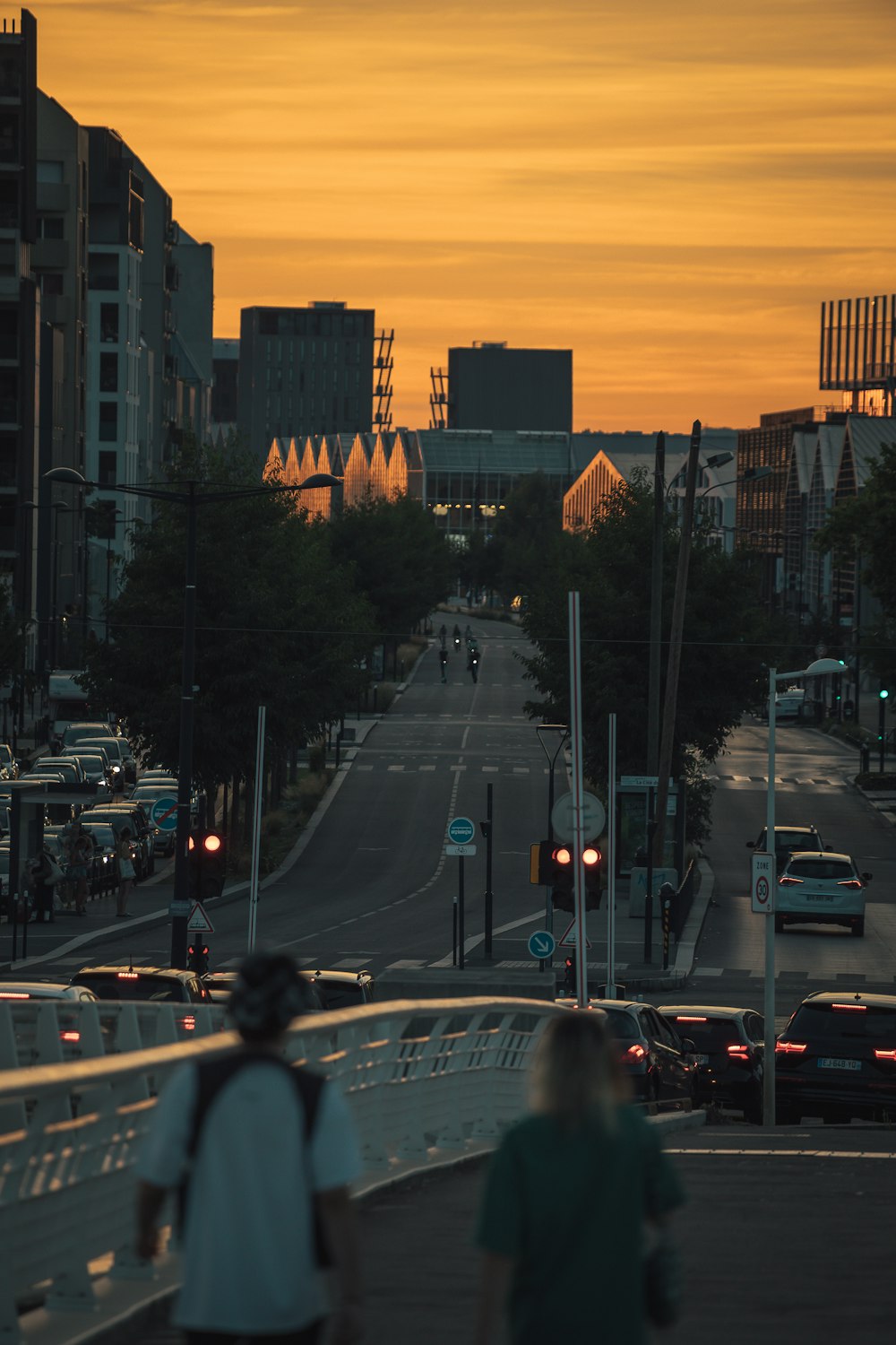 a city street with cars and people