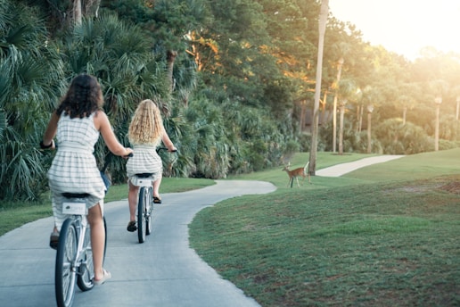 two women riding bikes