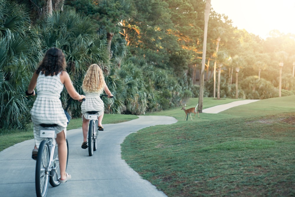 two women riding bikes