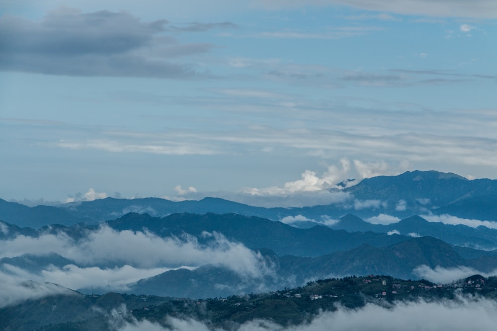 a view of mountains and clouds