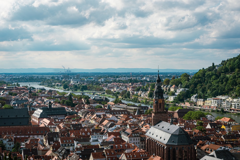 a city with a body of water in the background