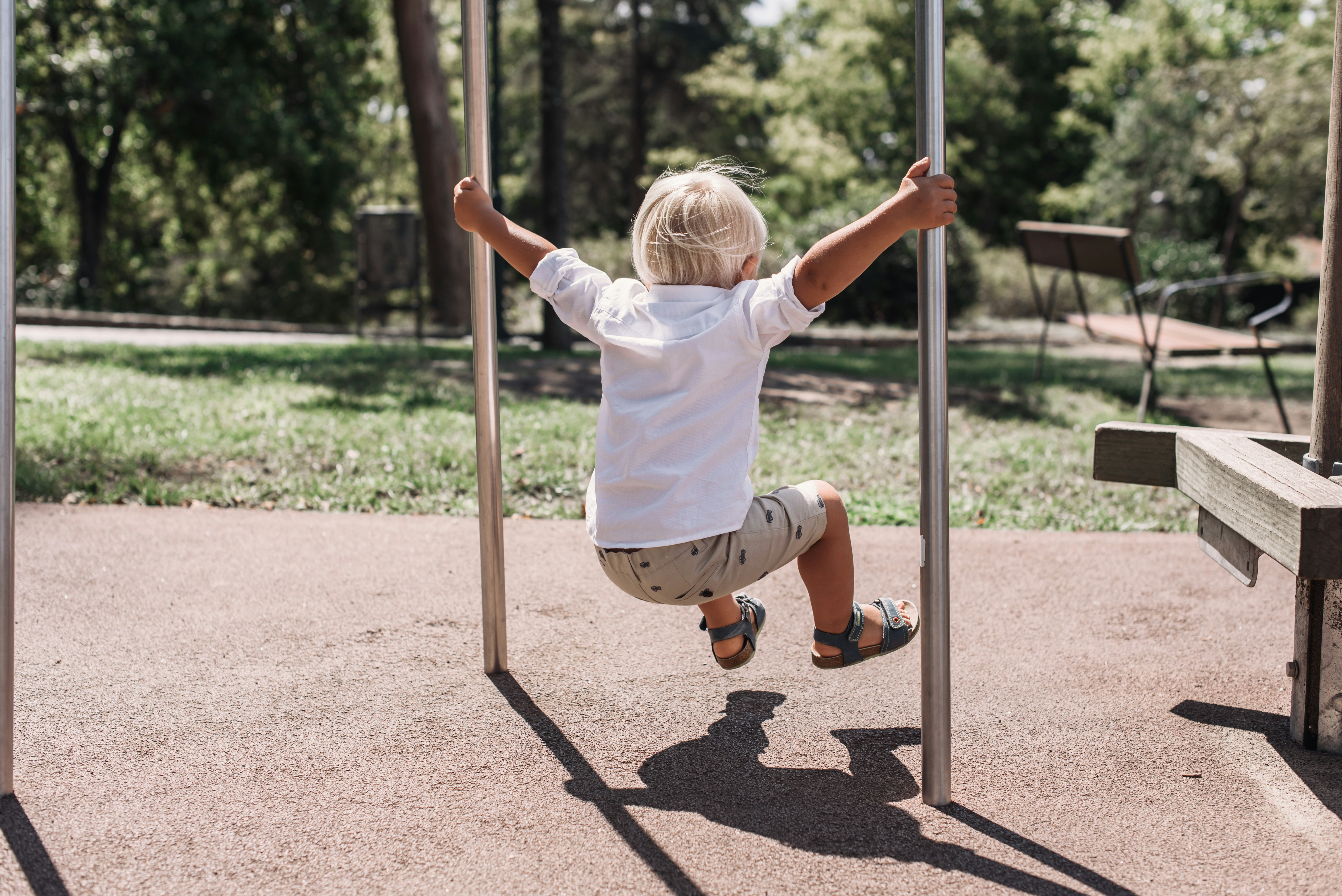 a child climbing on a pole