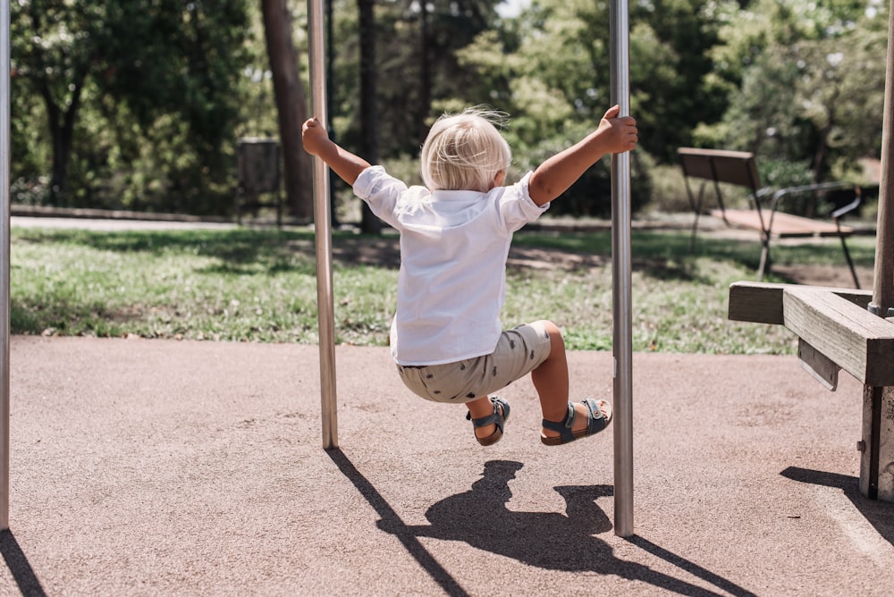 a child climbing on a pole