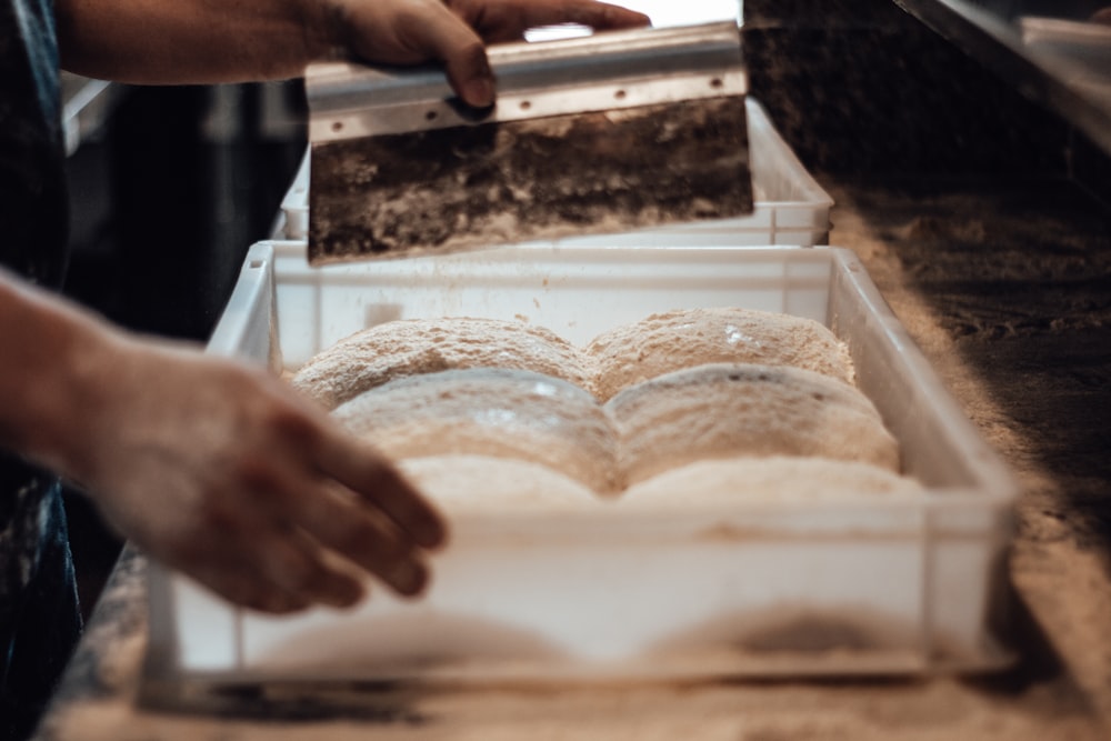 a person cutting bread