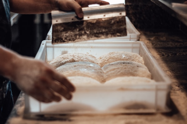 A person cutting bread