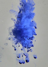 a blue liquid splashing