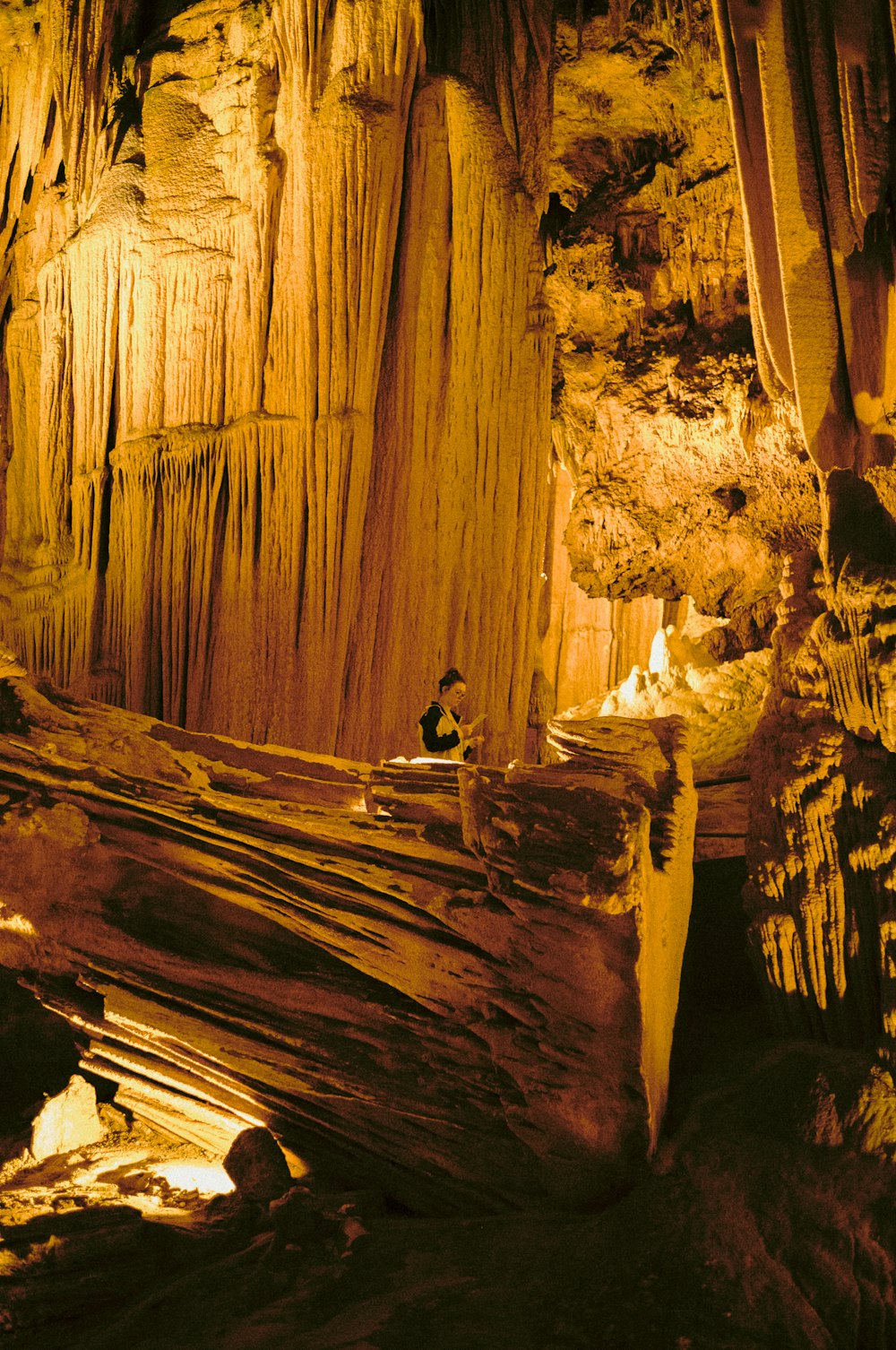 a person sitting in a cave