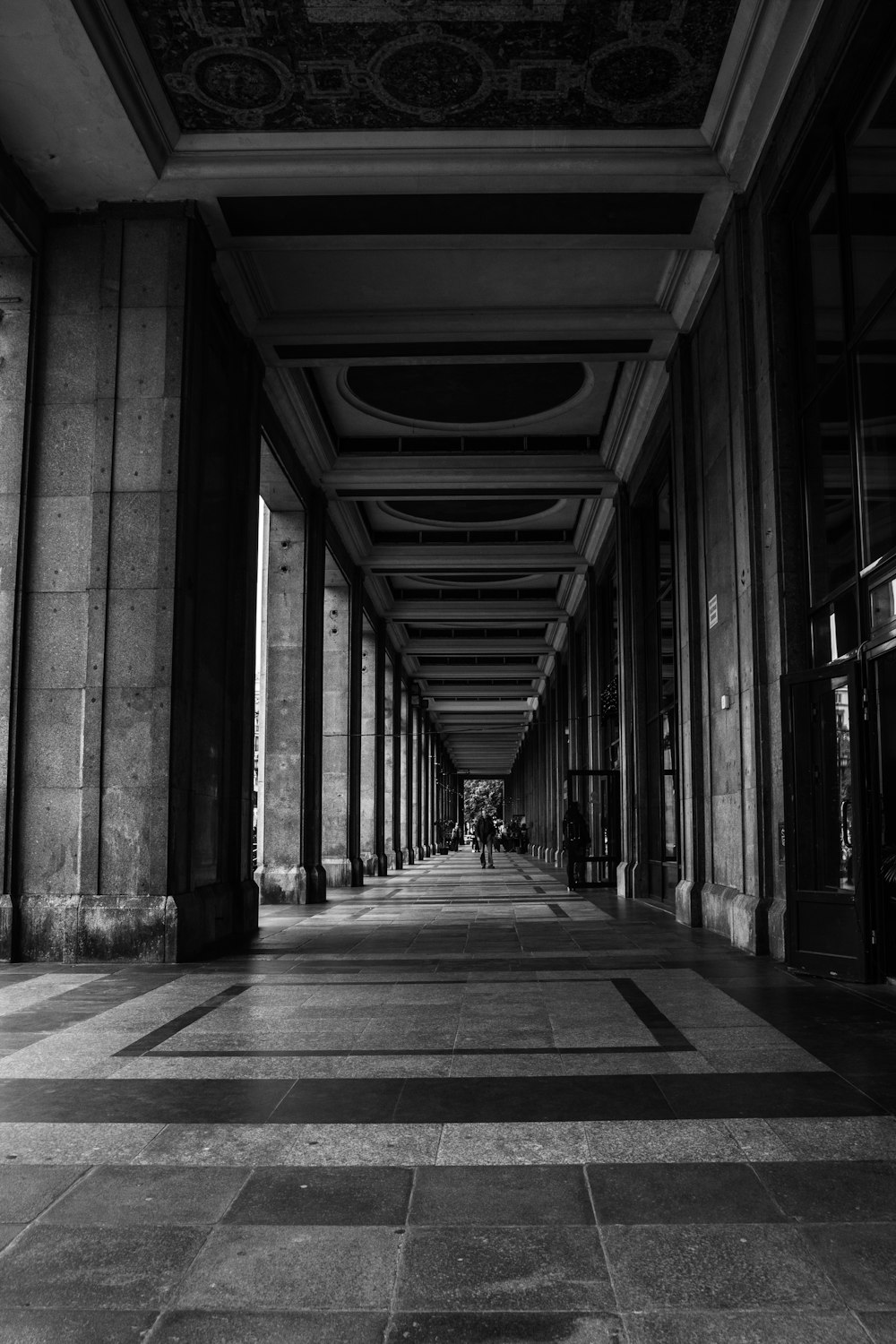 a large hallway with people walking