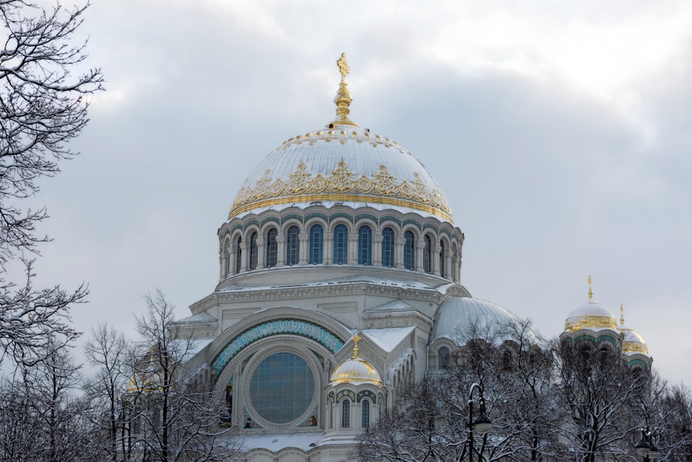 a large building with a gold domed roof