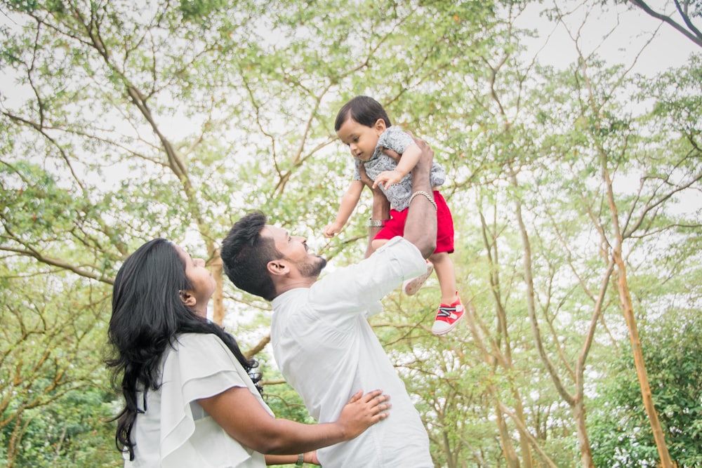 a person holding a baby