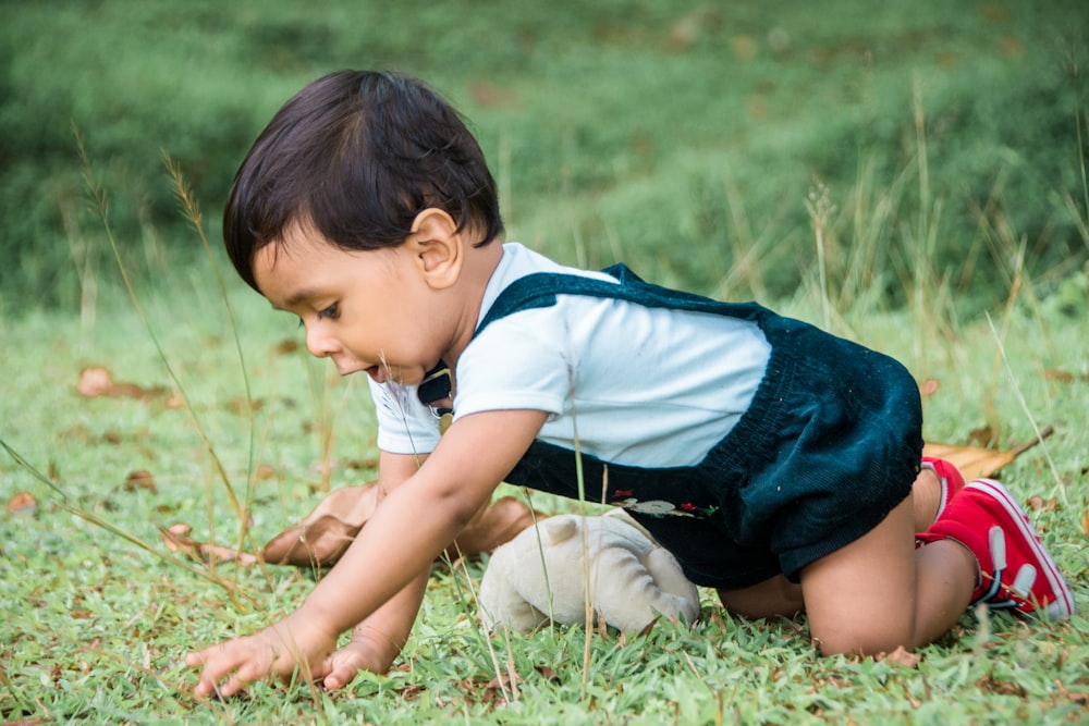 a young boy playing with a ball