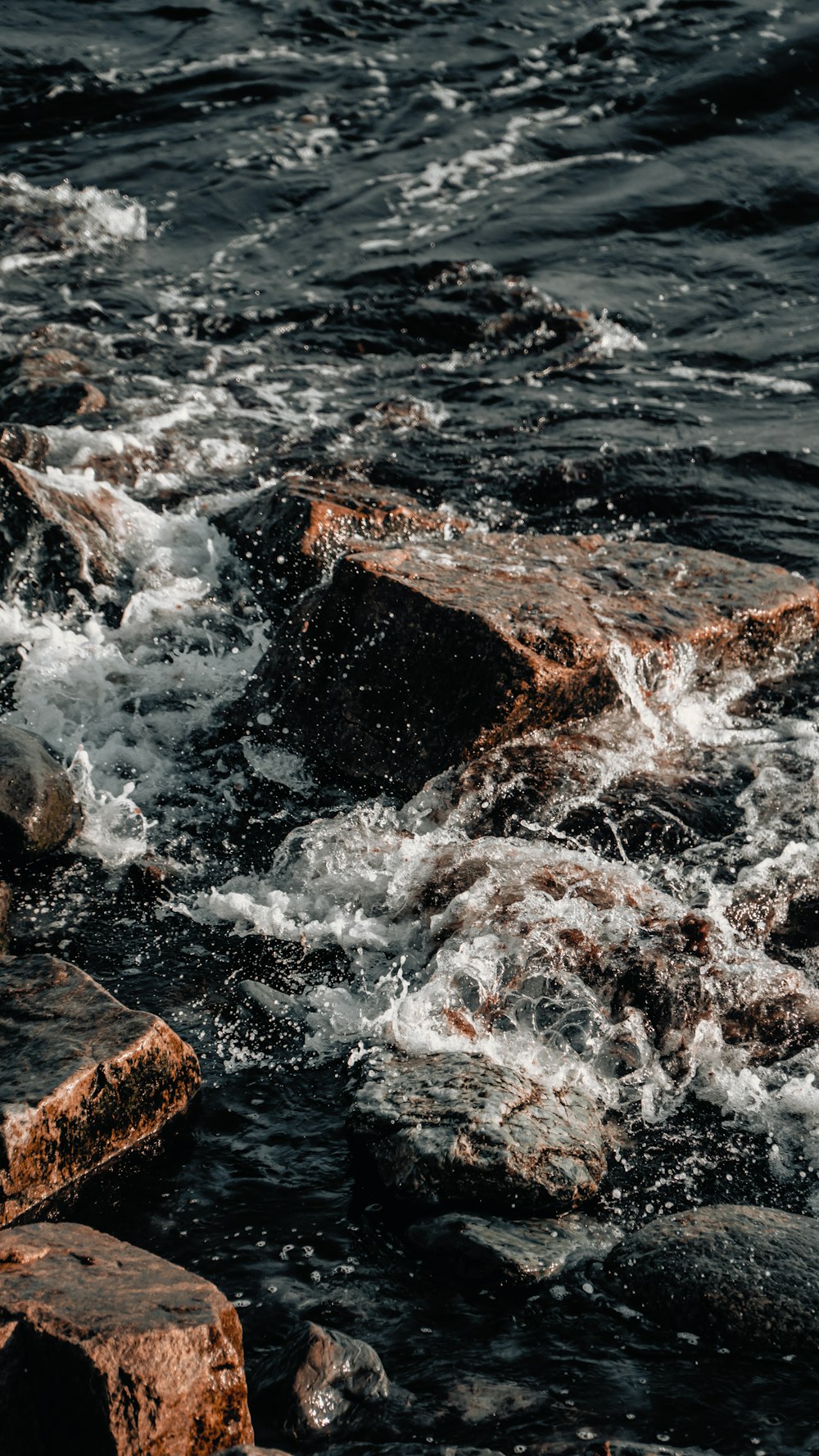 waves crashing on rocks