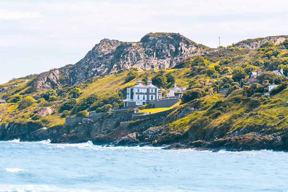 a house on a hill by the water