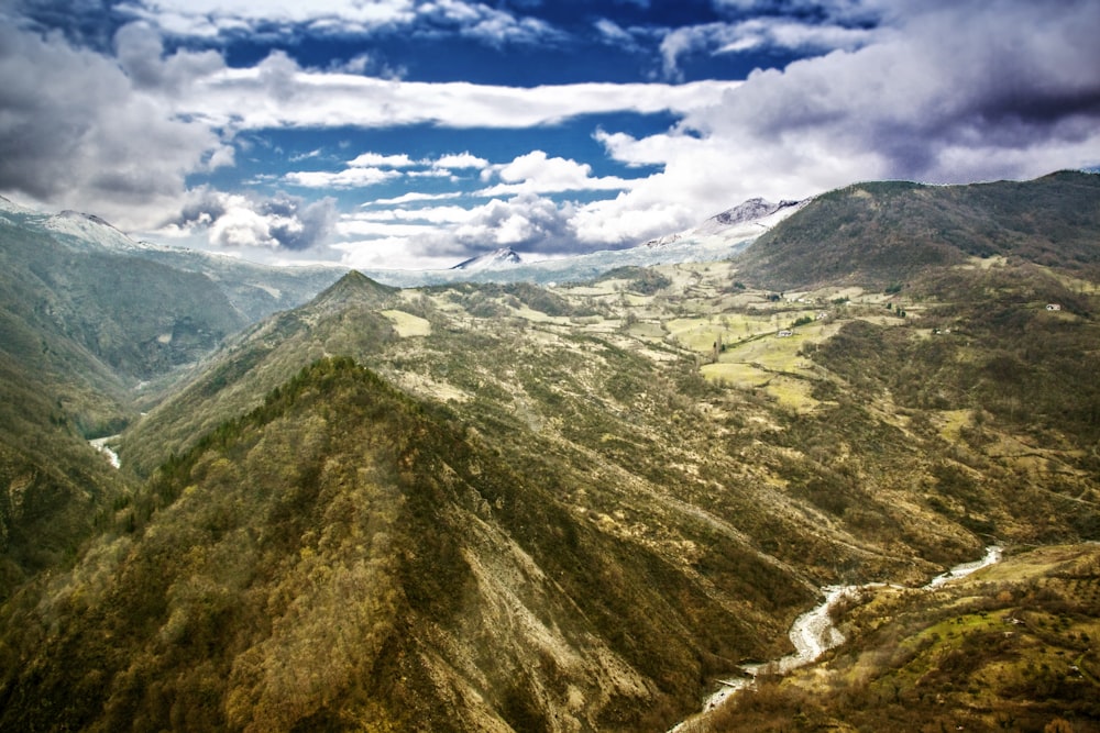 a mountain range with clouds